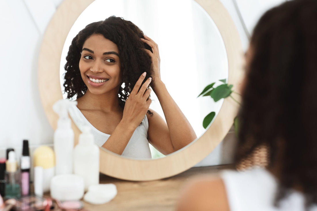 a lady standing infront of mirror and smiling