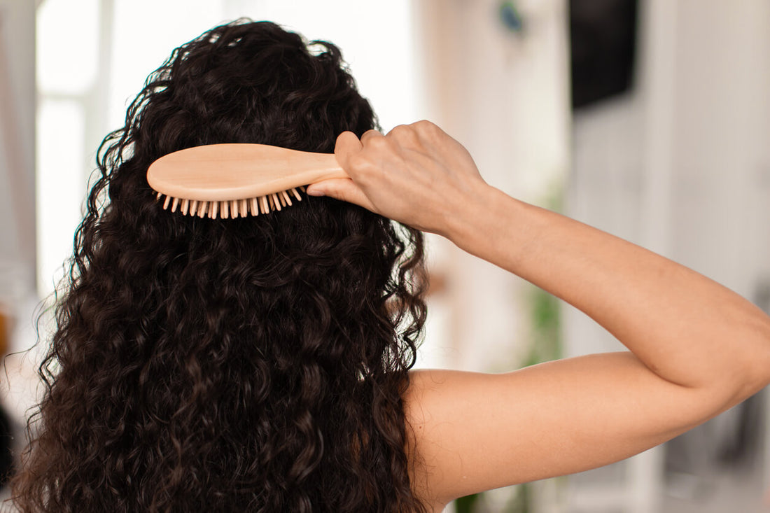 a person brushing their hair